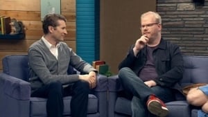 Jim Gaffigan Wears a Blue Jacket & Plum T-Shirt