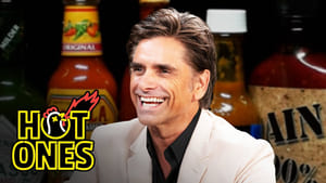 John Stamos Falls Out of His Chair While Eating Spicy Wings